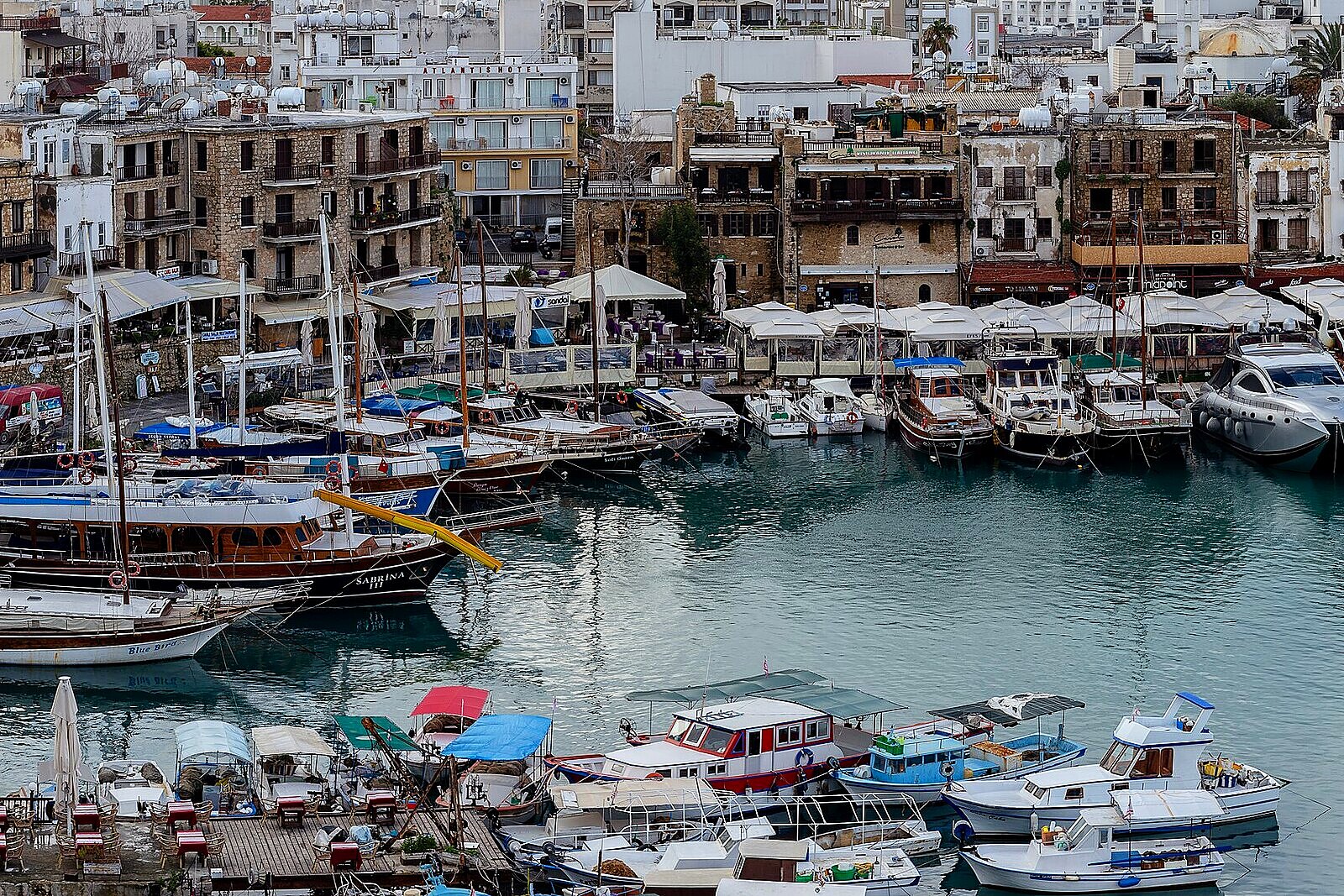 Historic harbour in Kyrenia with boats and old houses
