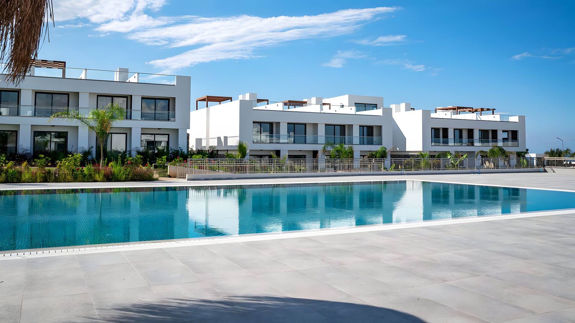 Main resort pool with white apartment buildings